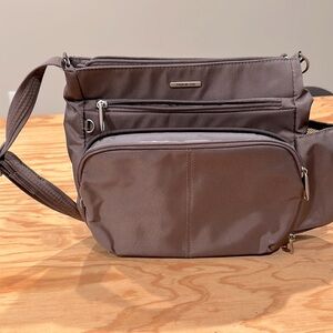NWOT , anti theft Travelon crossbody , multiple zipper compartments